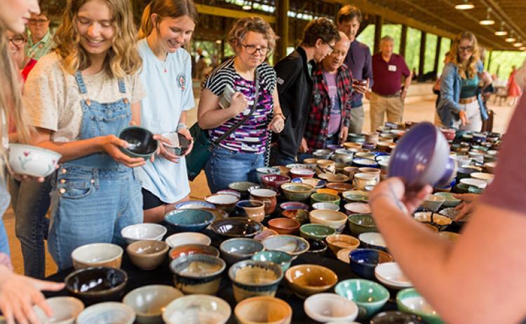 Selecting from the hundreds of beautiful bowls, all donated by local potters, is the hardest part of John C. Campbell Folk School’s annual Empty Bowls event.