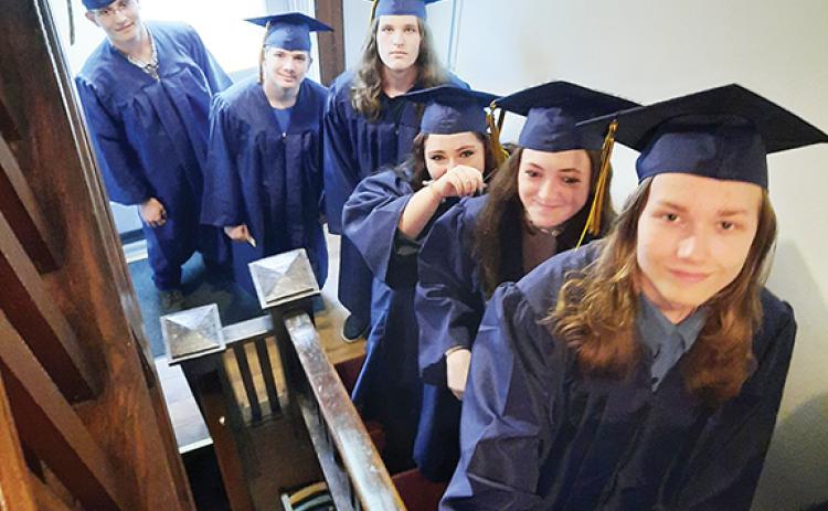 Photos by Anngee Quinones-Belian/Staff Correspondent  Seniors at The Oaks Academy proceed into the auditorium of Murphy First United Methodist Church prior to their graduation ceremony Thursday. From top are Rylan Hawkins, Courtney Kilpatrick, Paige Messer, Cameron Pendergrass, Logan Queen and Austin Reece.