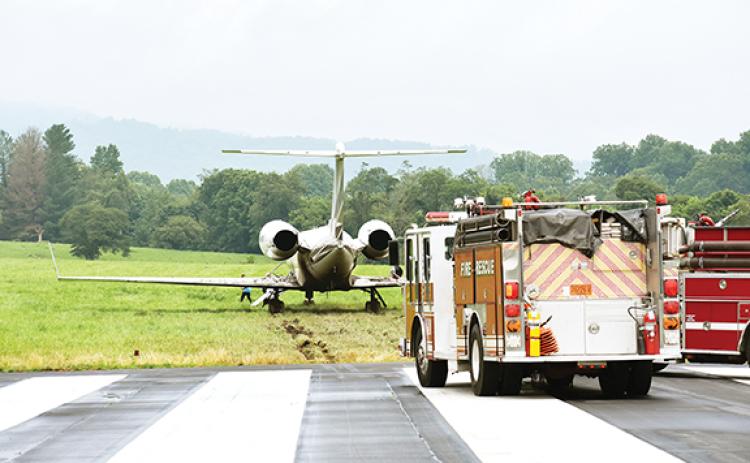 Photos by Randy Foster/editor@cherokeescout.com A Gulfstream IV jet rests on muddy grass at the east end of Western Carolina Regional Airport on Friday after the private aircraft overshot the runway during poor weather. Performers at the casino in Cherokee often fly into Andrews.