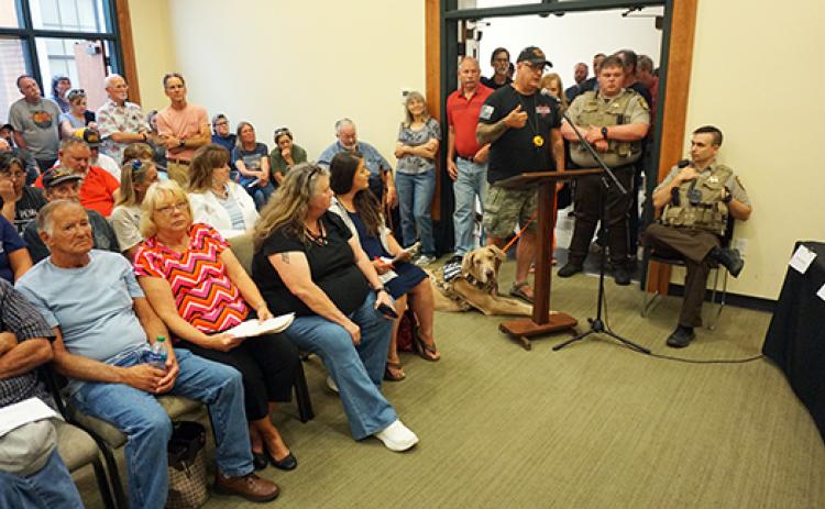 Randy Foster/editor@cherokeescout.com A standing-room-only crowd attended the Cherokee County Board of Commissioners meeting on July 17, including 15 people who signed up to talk about a proposed animal control ordinance.