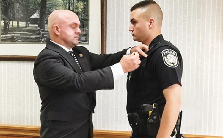 Andrews Police Chief Rocky Burrell and his son, Hunter Burrell, during his swearing-in ceremony last year.