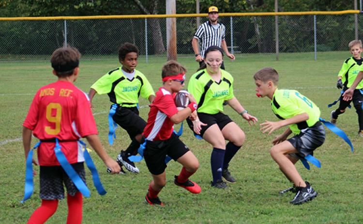 Flag football for ages 12 and under contains all of the game’s excitement, but with far less contact between players. 