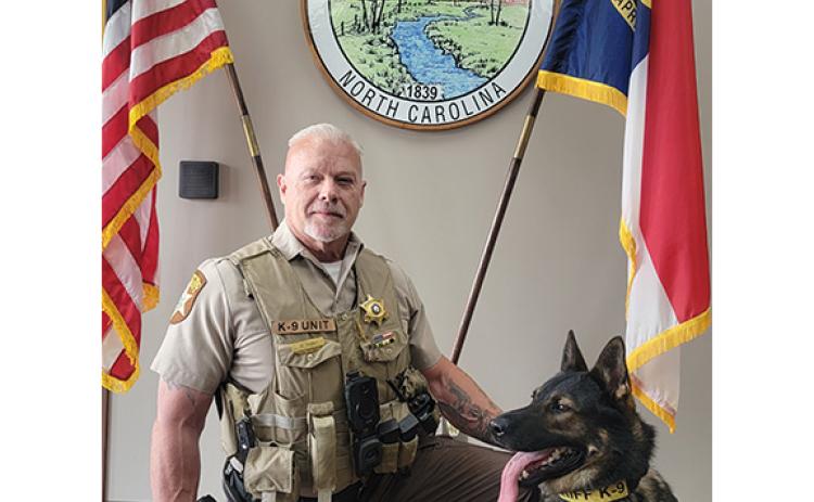 Deputy Dennis Dore and his K-9, Epic, pose for a portrait at the Cherokee County Sheriff’s Office in this undated photo. The team is considered the “gold standard.”