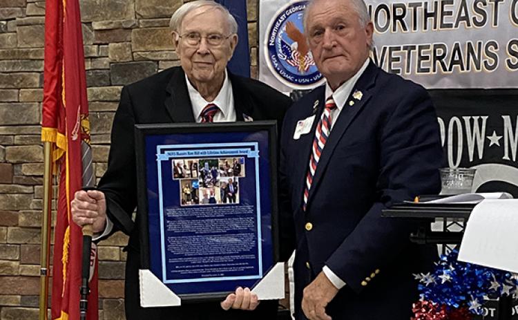 Ron Webb, president of the Northeast Georgia Veterans Society, presents a Lifetime of Service Award to Ron Hill (left) for his military service in three wars, civic service and service to other veterans over the last 70 years. Hill is a former local resident and Cherokee County manager.