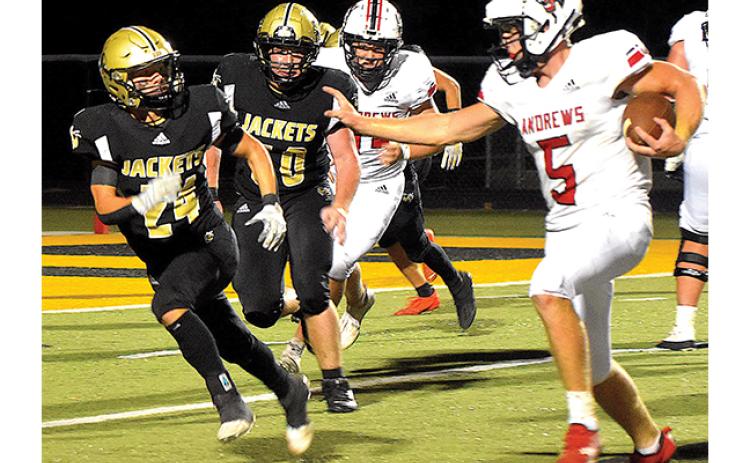 Andrews running back Dalton Rose (5) prepares to straight arm Hayesville’s Michael Mauney (24) as Rose angles for the end zone. 
