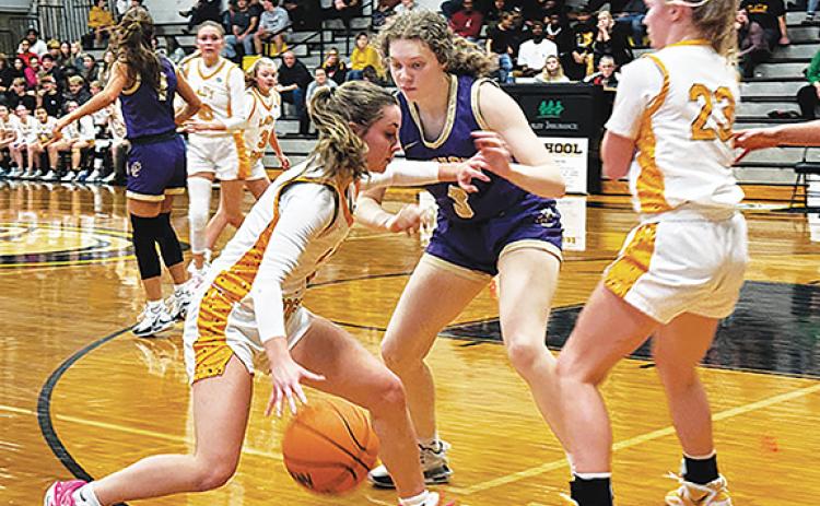 Photos by J.R. Carroll/Staff Correspondent Cayla Geer dribbles to get into scoring positon after a pick. 