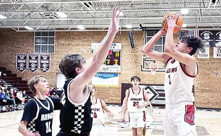 J.R. Carroll/Staff Correspondent Andrews’ Cam Rattler goes up for two points during the Swain County Christmas Tournament last week. The Wildcats’ boys team won both of their games.