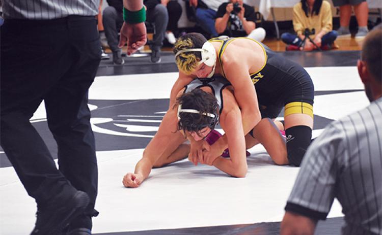 Audrey Colvin/The Graham Star Murphy’s Dalton Farmer (132 pounds) maintains top control over Robbinsville’s Christian Phillips in a consolation semifinal bout at the James Orr Invitational on Saturday.