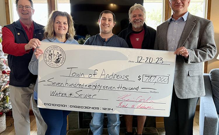 The real check for $787,000, which was distributed on Dec. 20, will come in handy as the Town of Andrews works to improve its water and sewer system. At left with the celebratory big check is state Sen. Kevin Corbin (R-Franklin), with state Rep. Karl Gillespie  (R-Franklin) at right. In the middle are Tammy Holloway and Ethan McCubbin with the town, along with Andrews Mayor James Reid. More than $11 million in state funding is earmarked for the town’s new treatment plant.