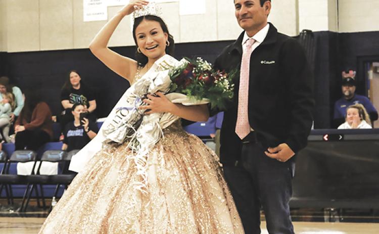 Cannon Crompton/sports@cherokeescout.com The 2024 Nantahala High School Homecoming Queen, Fatima Villagomez, celebrates with her father, Luis Villagomez, after wining the crown Friday night during the ceremony at halftime of the boys basketball game. Game story, page 2B.