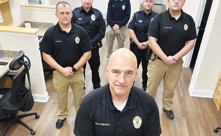 Randy Foster/editor@cherokeescout.com Murphy Police Chief Tim Lominac (front) stands with some members of his department Friday. Starting left and going clockwise are Investigator Jason Murphy, Officer Cody Williams, administrative assistant Jon Avery, Patrol Officer Parker Southard and Assistant Chief Ryan Cunningham. Not pictured are Sgt. Adam May, Cpl. Hunter Sanders, Officer Caleb Allen, and Basic Law Enforcement Training students Sara Taylor and Brayden Snow.