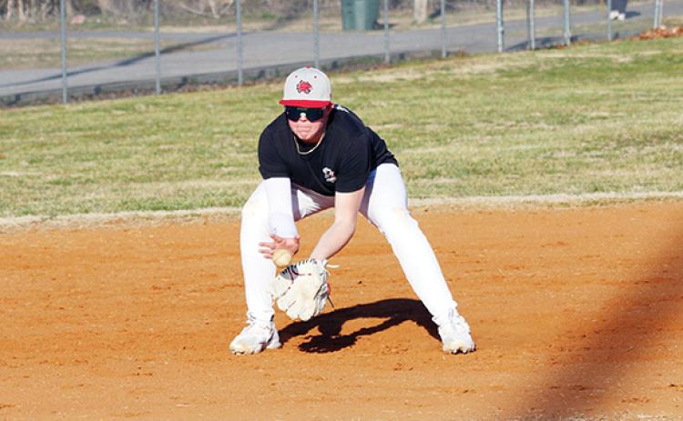 Cannon Crompton/sports@cherokeescout.com Andrews’ Aiden Garrett fields a ball during baseball practice last week.