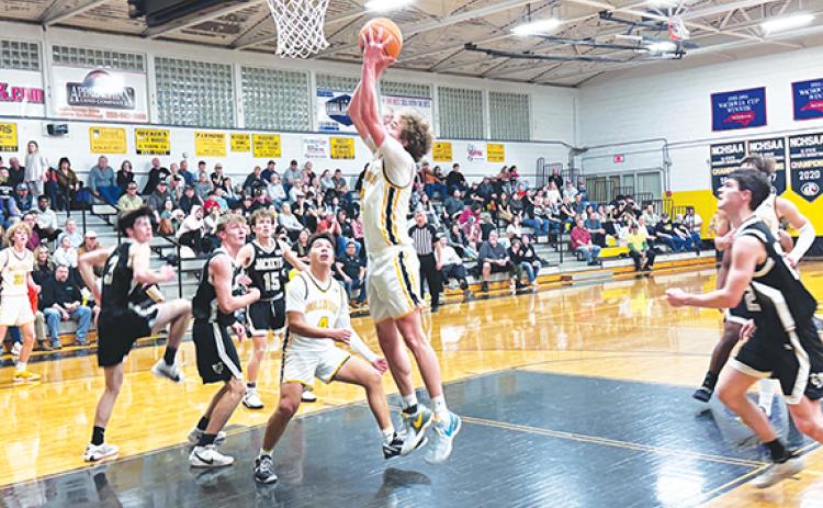J.R. Carroll/Staff Correspondent Murphy’s Hunter Carson goes up for a score as Xander Wachacha looks on Feb. 13.