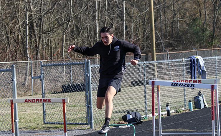 Cannon Crompton/sports@cherokeescout.com Andrews’ Jesus Jimenez works on hurdles during practice last week.