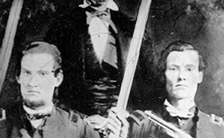George Washington Kirk (lower right) with his father and brother, Unionists all, in a family photograph from early in the Civil War.