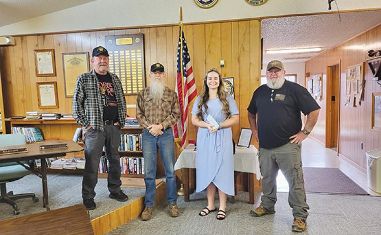 Nicole Wright/Staff Correspondent Andrews Veterans of Foreign Wars Post 7620 recently awarded its annual $1,000 scholarship to Carley Clark of Andrews High School. From left are Keith Welch, Scott Ramler, Clark and Mark Dockery.