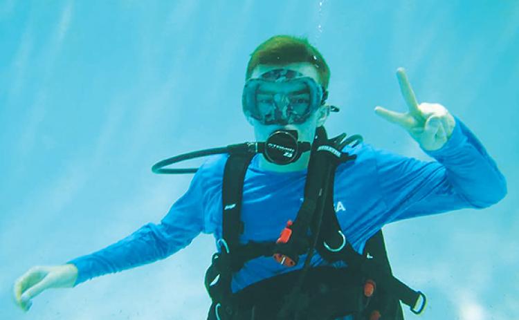 Kamdyn Koop loves being in the water and even became certified as a scuba diver. He hopes to explore the coral reefs in the future.
