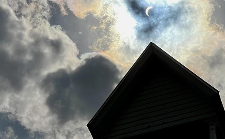 Randy Foster/editor@cherokeescout.com The solar eclipse as seen above Episcopal Church of the Messiah in downtown Murphy on Monday afternoon.