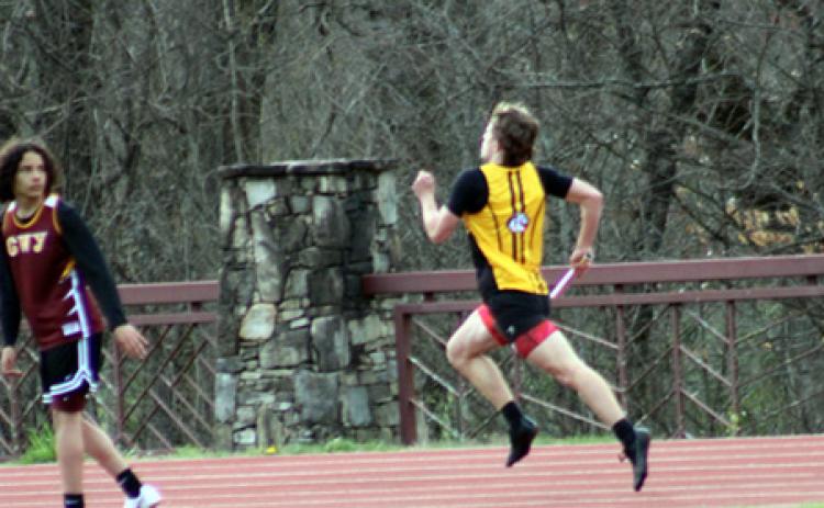 J.R. Carroll/Staff Correspondent Brady Grant of Murphy says, “I’m already gone,” while taking the relay on March 27.