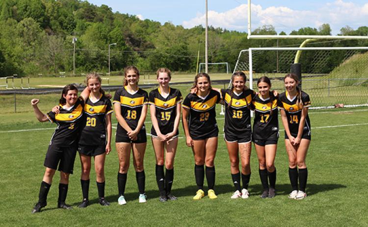 Cannon Crompton/sports@cherokeescout.com The Murphy Middle School soccer team celebrated Eighth-grade Night with a 5-1 win over Rabun Gap-Nacoochee, Ga., on May 2. Before the game, the team’s eighth-graders were honored. From left are Olivia Potter, Elizabeth Nave, Emma Elliott, Riley Johnston, Abby Lovingood, Deserae Zenobi, Ella Ledford and Addison Peterson.