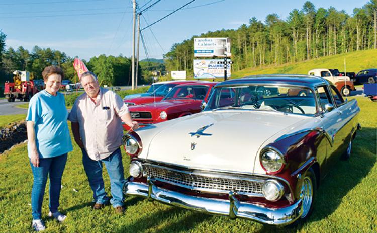 Photos by Bill Belian/Contributing Photographer  Diane Parker presented a $25 gift certificate from Parker’s Burgers & Sweets to Dennis Nicholson for the Parker’s Pick. Nicholson of Mineral Bluff, Ga., proudly displayed his ‘55 Ford Fairlane Crown Vic at the monthly auto show.