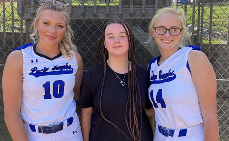 April McNabb/Contributing Photographer The Lady Eagles celebrated Senior Night on Thursday. Softball seniors Katie McNabb (left) and Shelby Kester (right) were joined by Miranda Landon (middle), a senior on the Eagles’ track and field team.